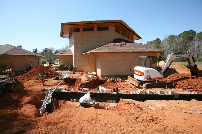 BobcatRestingByDirtpile